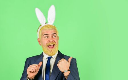 Funny boss. Easter activities for office. Bearded man bunny ears on head. Businessman wear bunny...