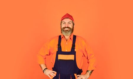 man wear boilersuit. bearded worker in overalls. Confident Mature Mechanic. Portrait Of Repairman. Worker in storehouse. Caucasian workman in storeroom. Mad repairman conceptの写真素材