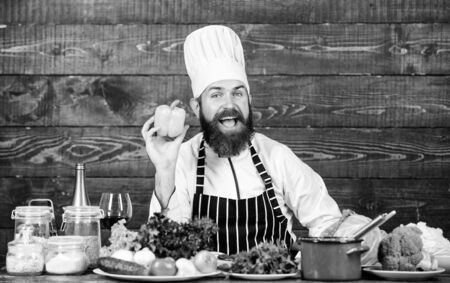 Dieting organic food. Healthy food cooking. Mature hipster with beard. Cuisine culinary. Vitamin. Vegetarian salad with fresh vegetables. Happy bearded man. chef recipe. Chopped vegetablesの写真素材