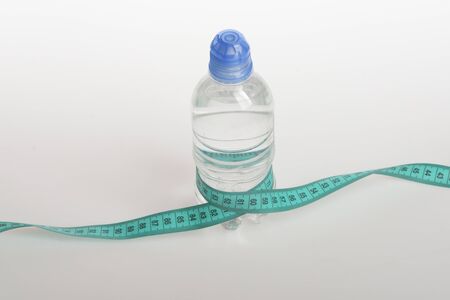Refreshment and healthy regime symbols. Bottle made of transparent plasticの写真素材