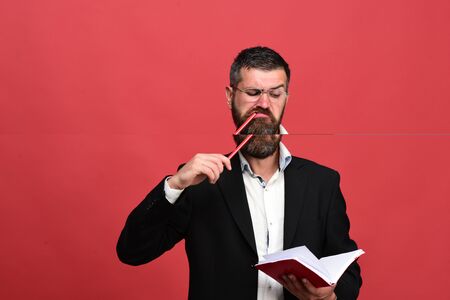 Businessman with serious and concentrated face and glassesの写真素材