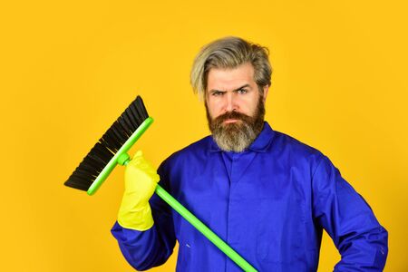 Janitor man sweeping. spring cleaning. clean service people. mature male worker with broom cleaning. Male Janitor Cleaning With Broom. Man cleaning home with broomの写真素材