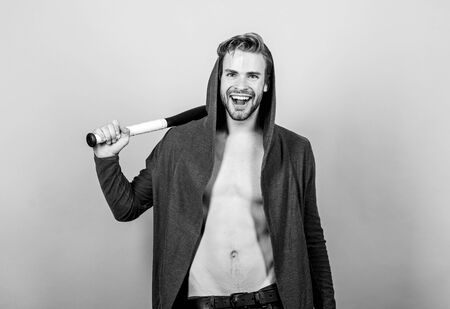 Pure perfection. perfect six pack. Hooligan macho hits the bat. man with baseball bat. Sexy muscular man fighting. Bandit gang and conflict. sport activity. full of energy. Sportの写真素材