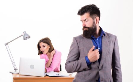 Typical office life. Office collective concept. Working together. Manager boss stand in front of girl busy with laptop. Office manager or secretary. Sexy lady office worker. Personal secretaryの写真素材
