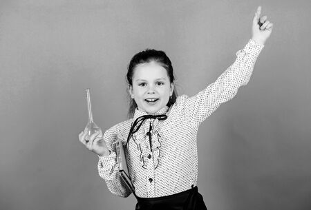 Chemistry fun. Schoolgirl with colorful chemical liquids. Having fun with chemistry. Education concept. Safety measures. Small kid study. Chemistry lesson. Insight and invention. Educative experimentの写真素材