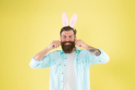 Proud of his moustache. Happy hipster twirl moustache. Mister rabbit wear long beard and moustache. Bearded man with stylish moustache hair. Barbershop. Barbers. Happy Easter. Spring timeの写真素材