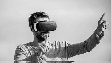 Cyber space. Game online. Man wear wireless VR glasses headset. Augmented reality. Use modern technology. Engineering project. Virtual reality goggles. Digital future and innovation. Virtual reality.の写真素材