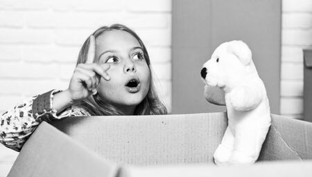 i have an idea. happy child cardboard box. happy little girl with toy. repair of room. new...