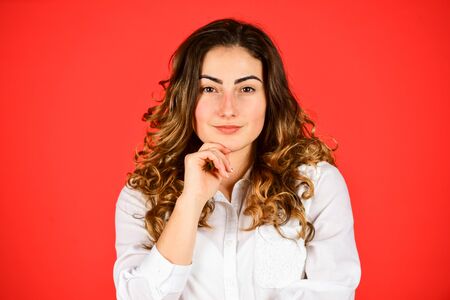 Woman satisfied hairdo. Hairdresser salon. Perfect look. Natural curls. Natural wavy hair texture. Woman with stylish curly hair. Hairdresser salon procedure. Hair health and care. Beauty and fashionの写真素材