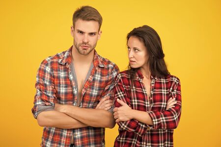 problems in relationship. couple break up. family psychology. man and woman checkered shirt. serious...