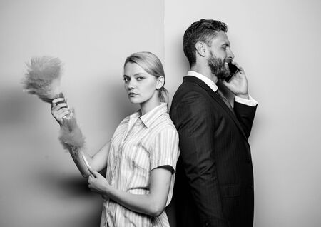 Housekeeping routine. Couple man and woman team. Housekeeping or business. Housewife and...