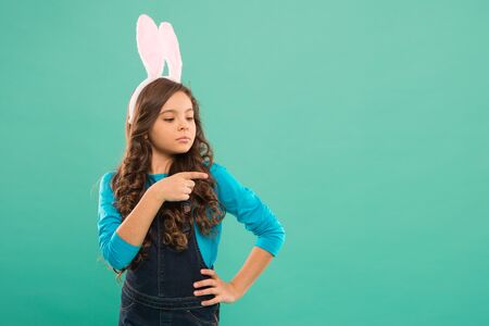Promoting goods. Small girl wear bunny ears. Kid in rabbit costume. Spring holidays. Easter funny...