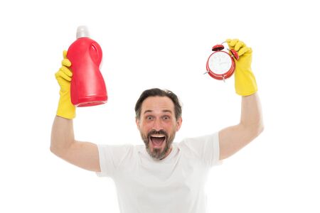Faster. Instant effect. Easy and quickly. Save your time with this cleaning product. Man in rubber gloves hold bottle liquid soap cleaning agent and clock. Bearded guy cleaning home. Cleanup conceptの写真素材