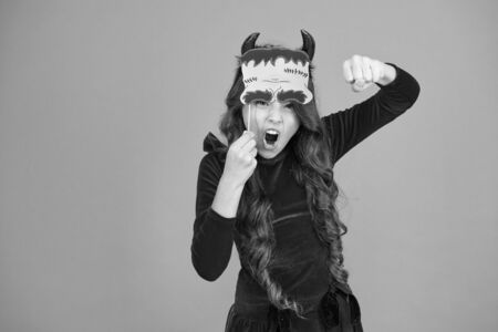 Trick or treat concept. Small child imp style accessory. Halloween party. Halloween costumes. Photo booth props. Autumn holiday. Little girl cute small horns celebrate Halloween. Carnival conceptの写真素材