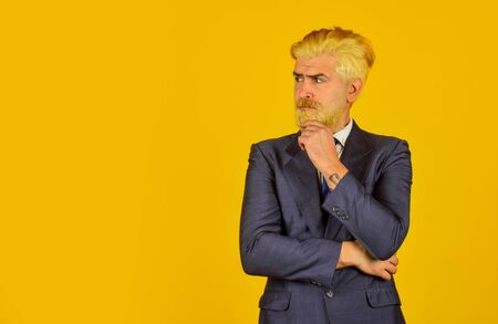 businessman in formal wear. business man in suit. Confident bearded man. leader CEO portrait. blonde hipster dyed beard hair. professional office manager. boss in stylish clothes. copy spaceの写真素材