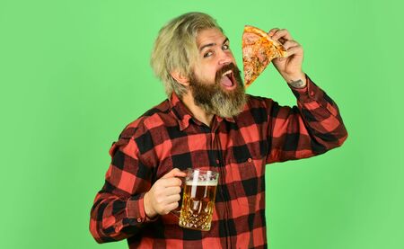 bachelor men club. Having fun and drink in bar. nice pub menu. man watching football while drinking beer and eating pizza. eating pizza and drinking. take-away pizza. Best party hereの写真素材