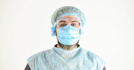 Garments placed to protect health. Infection prevention and control measures. Face protection goggles mask head cover. Personal protective equipment. Man wearing protective mask. Coronavirus pandemicの写真素材