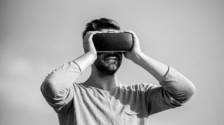 Designing 3d objects. Educational futuristic program. Cyber space. Virtual reality. Game online. Virtual reality goggles. Man with wireless VR glasses headset. Augmented reality. Designer or engineer.の写真素材