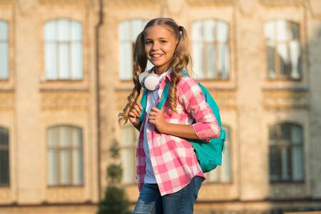 School life. Student. Modern education. Cheerful teen listening music. Schoolgirl going to school....