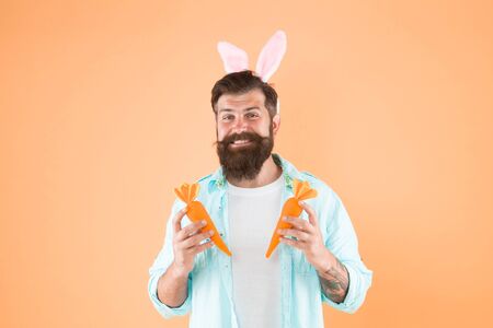 Super sweet yet healthy. Easter rabbit man hold carrots. Good health habits. Spring recipe for health. Healthy nutrition. Health benefits. Dieting for health. Easter fastingの写真素材
