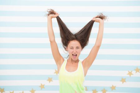 Pure beauty for your hair. Happy woman hold long hair. Beauty look of vogue model. Beauty and hair...