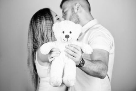 Loving relationship. man and woman embrace. couple in love. family relations and happiness. valentines day present. sexy girl and man hold teddy bear. romantic relationship. love date. family valuesの写真素材