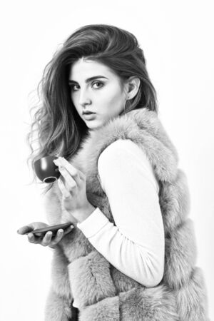 Elite coffee variety concept. Lady drink espresso little ceramic cup white background. Enjoy aroma and taste hot coffee. Elite drink with caffeine. Woman fur coat drink coffee. Elite coffee conceptの写真素材