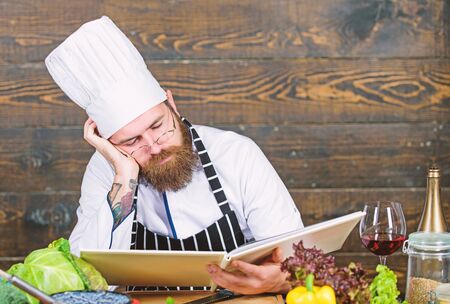 Healthy food cooking. Mature hipster with beard. Cuisine culinary. Vitamin. tired bearded man. chef recipe. Dieting organic food. Vegetarian salad with fresh vegetables. Enjoying new great dayの写真素材