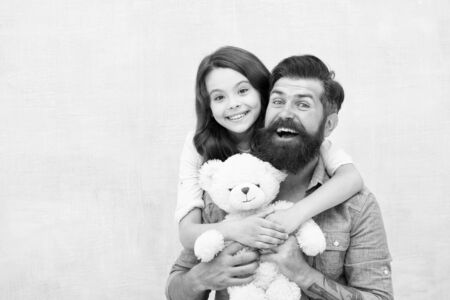 Teddy bear family member. Family relations. Fathers day concept. Lovely father and kid. Father and daughter light background. Strengthening father daughter relationships. Child and dad best friendsの写真素材