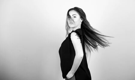 Nice and easy. Trendy crimped hairstyle. Fashion girl stylish hairstyle. Hair crimping method styling hair become wavy. Voluminous crimped hair. Curling and crimping hair. Hairdresser styling tipsの写真素材