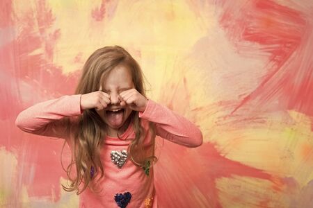 girl or small child show tongue on emotional face