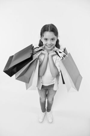 sale. small girl with shopping bags after sale. black friday sale. big sale on cyber monday.の写真素材