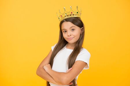 Young perfectionist. proud of her reward. luxury and success. selfish little girl wear golden crown. small princess kid. feel like champion. happy childhood. good motivation concept. she is big bossの写真素材