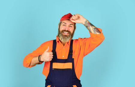 Fixing broken technics at home. Electrician plumber handyman. Call master. Renovation concept. Man skillful worker. Laborer. Repairman experienced worker. Help services. Handsome construction workerの写真素材