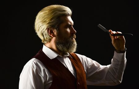 Barber scissors. barber shop. blond hairdresser or barber with scissors. Hipster Man Hairdresser. guy hairdresser cuts hair with scissors. male beauty salon. Make haircut look perfect.の写真素材