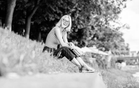 inspired by novel author. reading is my hobby. Summer study. student girl with book outdoor. interesting story. Relax and get new information. woman in park reading book. Capricious girlの写真素材