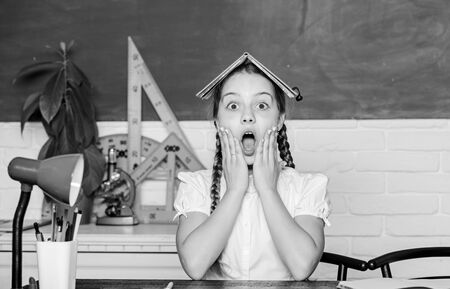 oh no. small girl study with in school. Formal informal and nonformal education. future success is studying. small child in classroom. back to school. digital age with modern technologyの写真素材