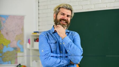 Private lesson. Back to school. Science concept. Mature bearded teacher in classroom. Study with interest. Man mentoring school projects. School subject. Basic education. History and geographyの写真素材