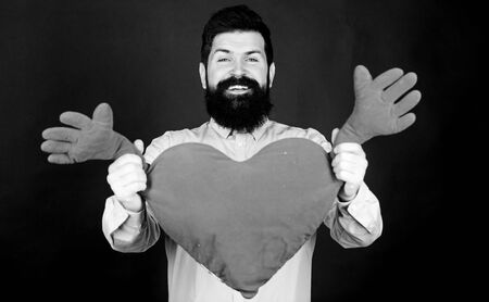 Man bearded hipster hug heart. Celebrate valentines day. Guy with beard and mustache in love romantic mood. Feeling love. Dating and relations concept. Happy in love. Physical touch. Free hugsの写真素材