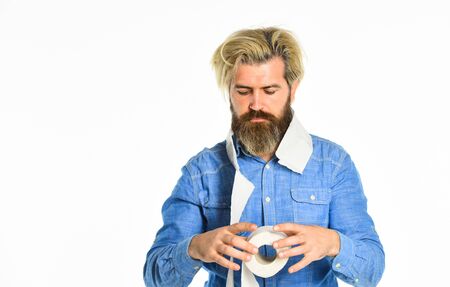 Better shiner toilet. panic shopping of toilet paper due to coronavirus crisis. hygiene and sanitary. man in public toilet. diarrhea concept. man paper in supermarket. roll of toilet paperの写真素材