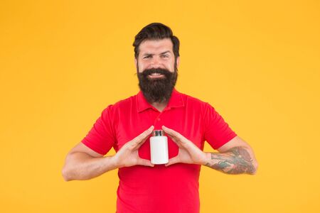 presenting product. jar of vaccine. Healthy Happy Smiling Man Going To Prepare Protein Shake Drink. anabolic and steroids. brutal bearded hipster man hold vitamin. medicine pills and drugs. haircareの写真素材