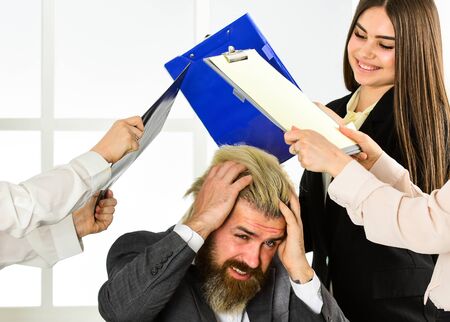 Going crazy because of women. Relations in female team. Psychological pressure. Flirting secretary and manager. Flirting with boss. Man and women colleagues. Too much attention to his personの写真素材