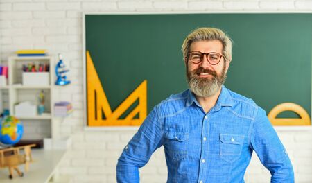 Back to school. Man teacher mentoring school projects. Science modern school. Math subject. Study in...