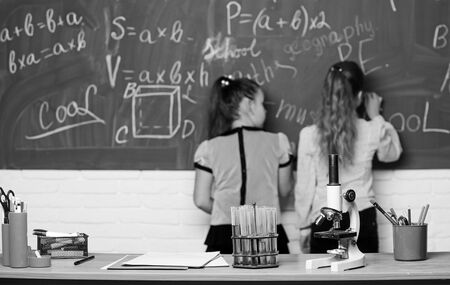 Analyzing strategy. Little girls scientist work with microscope. Chemistry research. Biology science. Happy little girls. science experiments in laboratory. Little girls in lab. Science is future.の写真素材