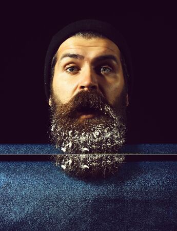 handsome man with snow on beard on black background, copy spaceの写真素材