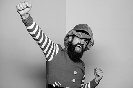 St Patricks day. Hipster with beard wearing green costume for party. Cheerful man celebrate holiday. Christmas elf. Elf concept. Traditions or customs. Happy celebration. Bearded elf. Winter carnivalの写真素材