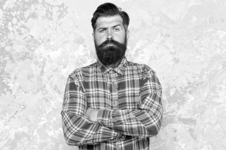 mature guy casual style. confident male hipster after barbershop. professional hairdresser in checkered shirt. brutal bearded man grunge background. serious man with lush beard and moustacheの写真素材