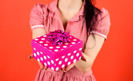 Box and gift concept. Girl holds bright pink gift boxの写真素材