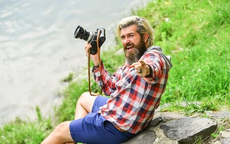 Best way to relax. paparazzi use digital camera. Photo shoot session. Handheld shooting. man photographer do shooting session. Shooting day hobby. Hobby and leisure. mature skilled camera manの写真素材