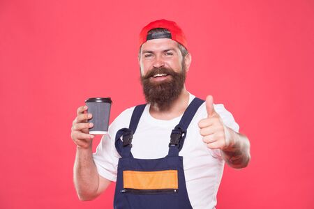 Tasty drink. take away coffee. man drink coffee to go. best aromatic coffee here. brutal man hipster drinking form paper cup. time to relax. coffee shop service. happy and cheerful baristaの写真素材